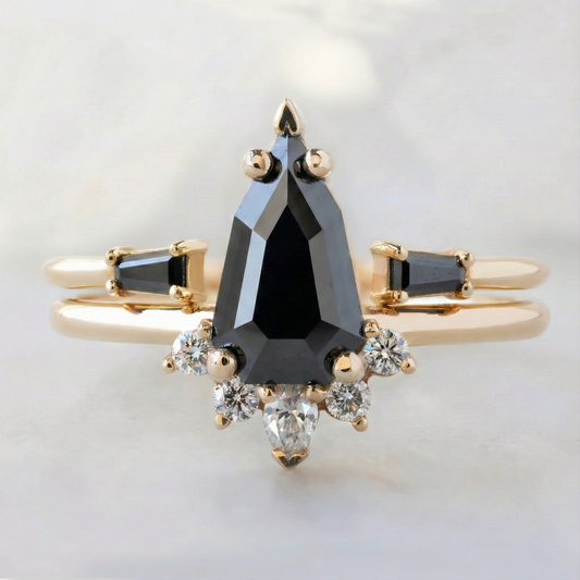Black and white diamond geometric engagement ring with V-prong setting.